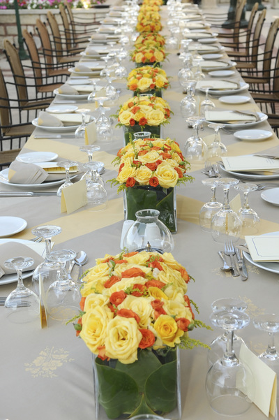 Formal table setting with plates and floral arrangement